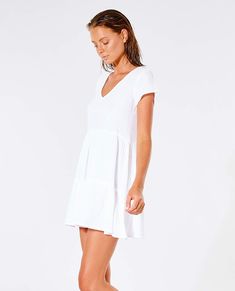 The Premium Surf Dress will be a staple piece for your collection this summer. Perfect to throw over bikinis or to dress up for a night out. Made in a relaxed fit and finished with shirring detail. Features: 100% cotton, Relaxed fit, Inner neck label, Metal logo trim, Shirring detail Model Wears Model is 176 cm (5'8) and wearing a size XS. Relaxed Fit V-neck Mini Dress For Vacation, Casual White Beach Dress For Poolside, White V-neck Dress For Poolside, White V-neck Poolside Dress, Relaxed Fit V-neck Mini Dress For Summer, Summer V-neck Mini Dress With Relaxed Fit, Chic Relaxed Fit Mini Dress For Vacation, Cotton Beachy Dress For Poolside, Beachy Cotton Dress For Poolside