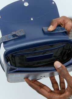 1DR shoulder bag in leather with denim-inspired print. Top handle Detachable adjustable shoulder strap Magnetic-fastening front-flap closure Front logo plaque One main compartment Two interior slip pockets 100% Leather Color: Blue Code: X08396 P6343 H7663 SKU: dsl0355005den Our Products Are 100% Genuine. In All Cases We Stand By The Authenticity Of Every Product Sold On Our Site. Blue Code, Diesel Men, Bottega Veneta Shoulder Bag, Blue Bags, Print Top, Top Handle, Bags Designer, Shoulder Strap, Color Blue