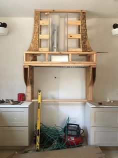 an unfinished kitchen is being built with tools