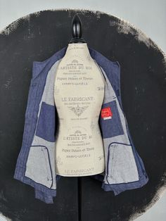 This is a nice vintage workwear jacket. The jacket is made of sturdy thick dark blue denim, darker than on the pictures (I could not get the exact colour). The jacket is made in France in excellent condition, seems never used. The jacket has a front zipper and pointed collar, 2 outer and 1 inner pockets.  MAKE: Adolphe Lafont, made in France. CONDITION: Excellent. MATERIAL: Cotton. MEASUREMENTS NOTE: Please refer to the exact measurements and sizing table I used, as this one does not have size l Pre-washed Denim Blue Cotton Outerwear, Blue Cotton Denim Jacket With Patch Pockets, Light Indigo Cotton Denim Jacket With Pockets, Denim Blue Cotton Utility Jacket With Patch Pockets, Washed Blue Cotton Utility Denim Jacket, Utility Style Washed Blue Cotton Denim Jacket, Washed Blue Cotton Utility Jacket, Utility Washed Blue Cotton Denim Jacket, Unstructured Blue Denim Jacket With Pockets