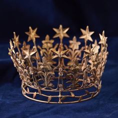 a gold crown with stars on it