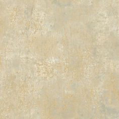 an old, dirty looking wallpaper with white and gold paint on it's surface