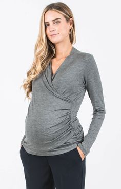 Versatile and beautiful, our long sleeved maternity and nursing top is available in Melange Grey. Made of soft, stretch and comfortable viscose jersey that drapes beautifully over your bump. The crossover wrap neckline is flattering throughout pregnancy and very practical for nursing. Just pull to one side for easy breastfeeding access once baby arrives. Pair with jeans for a daytime look or with smart trousers for a night out with friends. / Soft viscose jersey maternity top in Melange Grey / S Maternity Occasion Dress, Cute Maternity Shirts, Maxi Dress Wedding Guest, Pregnant Wedding Dress, Nursing Top, Cute Maternity Outfits, Maternity Shirt, Party Kleidung, Nursing Tops