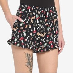 Unwind In Your Cozy Woodland Cottage In A Pair Of These Comfy Lounge Shorts! They Feature An Allover Cottagecore-Themed Print, Highlighting Mushrooms Frogs And Other Forest Flora. Comes With Ruffled Trimming, Side Seam Pockets And An Elasticated Waistband. 100% Cotton Modeled Shorts Are Not Identical But Show Styling. Inventory #P6407 Cute Black Loungewear Bottoms, Black Bottoms For Summer Pajama Party, Black Bottoms For Pajama Party In Summer, Black Shorts For Pajama Party, Casual Black Bottoms For Pajama Party, Black Bottoms For Pajama Party In Spring, Casual Black Sleepwear For Spring, Black Casual Short Sleepwear, Casual Black Short Sleepwear