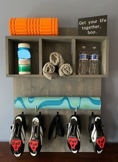 there is a shelf with towels and shoes on it