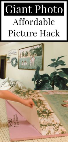 a person laying on top of a bed in front of a plant and some pictures