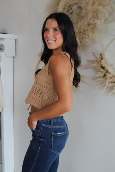 Elevate your wardrobe with our chic crochet vest top, designed for effortless style and comfort. This sleeveless piece features a playful tie-front detail and a flattering plunging V-neckline, adding a touch of sophistication to your look. The delicate crochet pattern adds texture and a hint of bohemian flair, perfect for layering or wearing solo. Ideal for warm weather or a sun-soaked getaway, this vest top effortlessly combines fashion and function. for reference Karlee is 5’8 and wearing a si Crochet Bows, Square Neck Top, Crochet Vest, Vest Top, Cardigan Jacket, Skirts For Sale, Sweater Jacket, Effortless Style, Sleeveless Top