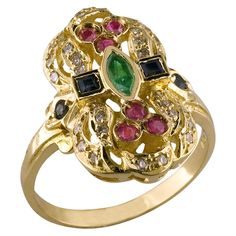 S.Georgios Hand Made 18 Karat Yellow Gold Ring decorated with Byzantine-era style granulation and a combination of Diamonds, Rubies, Emerald, and Sapphires. The stunning ring features Brilliant cut Diamonds with a total weight of 0.22 Carat, and Rubies, Sapphires and an Emerald center all a total weight of 0.80 Carat. It can also be ordered in White or Rose Gold. This gorgeous ring is of top quality and workmanship and is made in our workshop at Kouzoupis SA in Athens Greece. Length: 21,30 mm We Diamond Cocktail Rings, Gem Ring, Domed Ring, Antique Diamond, Yellow Gold Ring, Brilliant Cut Diamond, Yellow Gold Rings, Cocktail Rings, Diamond White