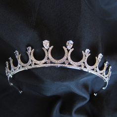 This celestial tiara is platinum plated and encrusted with AAA-grade cubic zirconias.  Attach to the head by stringing provided elastic ribbon through loops at the back. Height: 3cm  Width: 15cm Celestial Tiara, Moon Crown, Crystal Spikes, Crown Crystal, Elastic Ribbon, Elegant Hair, Crystal Headpiece, Wedding Tiara, Elegant Hairstyles