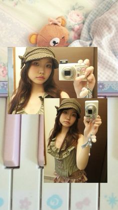 a woman taking a selfie in front of a mirror with a teddy bear on it