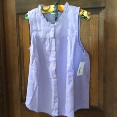 Sleeveless Lavender Top. Ruffled Collar. New. Spring Lavender Sleeveless Tank Top, Lavender Sleeveless Tank Top For Spring, Sleeveless Lavender Cotton Top, Lavender Sleeveless Cotton Top, Sleeveless Lavender Cotton Tank Top, Purple Sleeveless Blouse For Spring, Purple Tank Top For Spring Day Out, Purple Cotton Sleeveless Blouse, Sleeveless Purple Cotton Blouse