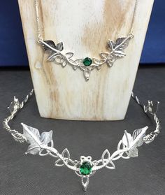 "I will create this magically ethereal, woodland-Inspired wedding jewelry set, complete with your choice of gemstone for the piece. I've designed this for the alternative bride-to-be, featuring a bohemian, art nouveau quality - elegant and unique in one! This jewelry set includes: Tiara Bracelet cuff Necklace Leaf Earrings I will fabricate everything in sterling silver and the circlet comes with a 10mm gemstone size, and the matching necklace comes with an 8mm faceted, respectively. The necklace Bohemian Green Wedding Jewelry, Handmade Adjustable Silver Bridal Necklace, Adjustable Silver Round Bridal Necklace, Silver Adjustable Bridal Necklace, Adjustable Hand Set Sterling Silver Jewelry, Adjustable Hand Set Silver Necklaces, Adjustable Hand Set Silver Necklace, Bohemian Crown Shaped Jewelry Gift, Bohemian Silver Jewelry For Wedding