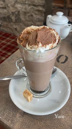 a cup of hot chocolate with whipped cream on top