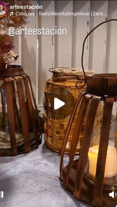 two wooden lanterns sitting next to each other