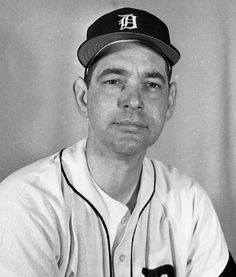 a black and white photo of a baseball player