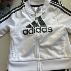 Very Stylish, Never Worn Adidas Jogging Suit!! Don’t Miss Out! White Long Sleeve Playwear Sets, White Long Sleeve Sports Sets, Sporty White Long Sleeve Set, Fitted White Adidas Sets, Sporty White Playtime Sets, Adidas White Long Sleeve Set, Adidas Jogger, Adidas Joggers, Jogging Suit