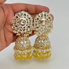 Bollywood Kundan Pearl Jhumka/Jhumka Earrings/Big jhumka/kundan Earrings/Indian earrings/Punjabi/Pakistani Jewelry/Bridal/Indian Wedding Length: 3.2 Inches; Width: 1.8 Inches Color, shades, texture displayed may slightly vary from the actual product due to digital image limitations. We request you to consider these minor variations. Please expect the possibility of some slight imperfections when buying handmade jewelry. If you have any questions, please contact us. Arrives in gift box. Please let me know if you have any questions. Thank you so much visiting my shop. Yellow Bollywood Chandbalis For Wedding, Yellow Chandbalis For Wedding And Festivals, Traditional Yellow Bridal Earrings For Wedding, Yellow Chandbali Earrings For Diwali, Festive Yellow Chandbali Jhumkas, Yellow Bollywood Earrings For Wedding, Yellow Chandbalis With Latkans For Wedding, Yellow Meenakari Chandbalis For Wedding, Yellow Chandbali Jhumkas For Wedding