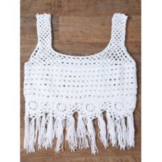 a crocheted top with fringes on it