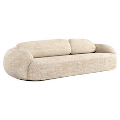 a beige couch sitting on top of a white floor