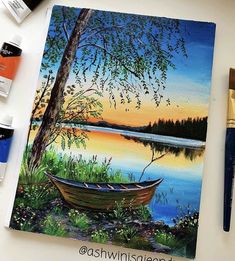 a painting of a boat sitting on top of a table next to paintbrushes