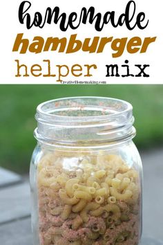 homemade hamburger helper mix in a glass jar with the title above it and an image of