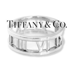 Tiffany & Co. Atlas 18k White Gold Open Roman Numeral This Amazing Tiffany & Co. Atlas Ring Features A Roman Numeral Design Around An Open Design Band In 18k White Gold. Signed, 'Atlas 2003 Tiffany & Co. Total Weight 5.9 Grams Comes New In Box! Size Is 6.5! Please See Photos Above! Gets Sent To Poshmark For Authentication! Roman Numeral Design, Tiffany Ribbon Ring Engagement, Tiffany Atlas Ring, Tiffany Lucida Ring, Tiffany 1837 Ring, Tiffany Atlas Rings, Tiffany Co Rings, Tiffany And Co 1837 Ring, Jewelry Tiffany