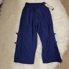 Paradiso Navy Blue Pull On Wide Leg Ankle Pants. Elastic Waistband. 2 Front Pockets. Slit Openings On Sides Of Legs With Flaps And Buttons. 100% Rayon. Washable. Size Medium. Approximate Measurements 12" Across Waist Unstretched. 13" Rise. 25" Inseam. 15" Slit. 9" Leg Opening. New With Tags. Wide Leg Ankle Pants, Yellow Sweatpants, Wide Leg Pants Jeans, Light Blue Pants, Cropped Cargo Pants, Low Rise Pants, Ruffle Pants, Cuffed Pants, Velvet Pants