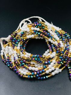 "❀ This listing is for  2 strands of waistbead ❀ Beads Ship directly from Ghana ❀ Bead length is 47\"Note. Bead length cannot be made longer than 47inches. ❀ Regular Beads sizes vary from size 6/0 to 8/0, 11/0 to 8/0 ❀ DHL requires customer's phone number during shipment, please provide one ❀You will receive quality & gorgeous waistbeads not limited  to the ones in the display pictures ❀ Beads are made with Cotton Strands to prevent any allergic reactions ❀ Shipping takes 3-5 Business days after processing(3-4 business days) ❀ Email me with any questions. I am usually quick at responding" Bohemian Waist Beads With Spacer Beads For Party, Bohemian Waist Beads For Parties With Spacer Beads, Adjustable Multicolor Faceted Waist Beads, Bohemian Beaded Waist Beads For Parties, Multicolor Beaded Waist Beads For Party, Adjustable Waist Beads For Parties, Party Waist Beads With Beaded Chain, Party Beaded Chain Waist Beads, Multicolor Waist Beads With Gold Details