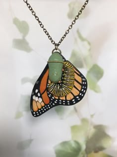 Kia ora! I ship from beautiful little Nu Tireni/New Zealand, please take the shipping times into account before purchasing. I do recommend using the tracked shipping option as your parcel has a way to fly! Thanks for stopping by - Lisa xx  The Monarch butterfly is one of the most recognised butterflies in the world. Loved by so many, the often are symbolic of a personal journey taken.  This beautiful butterfly is hand shaped from wood, then painted by me and includes a freshly formed chrysalis and caterpillar, showing the amazing transformation a butterfly goes through. The pendant comes on a 45cm (18 inch) black leather cord, however this can be changed to gold tone, silver or antique bronze chain, please select your choice upon ordering. Check my other listings for variations of this bea Monarch Butterfly Accessories, Moth Necklace, Monarch Butterfly Earrings, Monarch Butterfly Necklace, Nature-inspired Butterfly Charm Necklaces, Insect Jewelry, Funky Jewelry, Nature Jewelry, Dream Jewelry