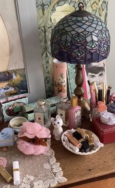 a table topped with lots of different types of makeup and personal care items on top of it