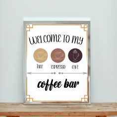 a sign that says welcome to my coffee bar on the side of a wooden table