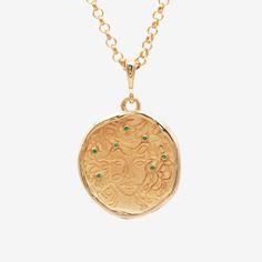 This piece features a delicate line drawing of Medusa with emeralds strewn through her hair, engraved in 18k gold vermeil. Wear this medallion when you're planning to threaten male authority or feel like to turning people into stone. Celestial Round Collectible Necklaces, Celestial Round Pendant Necklace For Collectibles, Celestial Hallmarked Round Pendant Necklace, Celestial Style Hallmarked Round Pendant Necklace, Medusa Necklace, Common Era, Elizabeth Johnson, Gold And Emerald, Hair Inspired