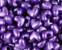 purple heart shaped beads with holes in the middle