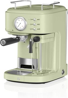 the sage green coffee maker is on display