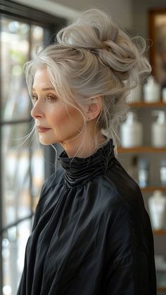 into effortless chic with a high messy bun – a trendy and versatile hairstyle perfect for older women seeking both style and convenience. This elevated yet relaxed look adds a touch of casual elegance to any outfit, perfect for busy days or special occasions. Click to explore more age-defying hairstyles and follow us for daily inspiration! #HighMessyBun #EffortlessChic #HairstylesForOlderWomen #CasualElegance #TrendyHair Older Punk Women, Long Silver Hair Older Women, Updo Hairstyles For Long Hair, Long Hair Older Women, Hairstyles For Older Women, Long Gray Hair, Age Defying, Women Over 50