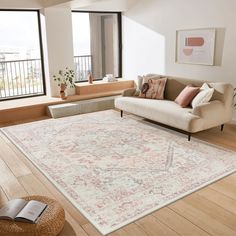 a living room filled with furniture and a large rug