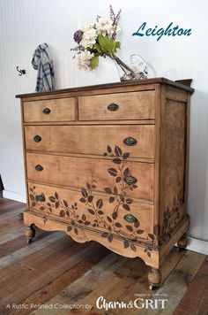 an old dresser with flowers on it