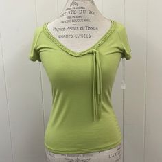 New With Tags Dead Stock Early 2000s Vintage Green V Neck Top. Short Sleeve. Woven Neckline. Cut Out Detail At Back. Brand Alegria. Made In Italy. Viscose And Elastane. Gtd/Cp Spring Stretch Lime Green Top, Fitted Lime Green Casual Top, Casual Fitted Lime Green Top, Green V-neck Y2k Tops, Fitted Light Green Top For Spring, Cleveland Browns Sweatshirt, Faux Vest, Black Chiffon Blouse, Ice Tie Dye