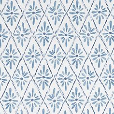 a blue and white wallpaper with flowers on it