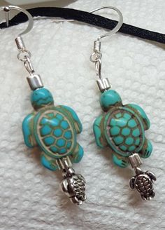 "Handmade Jewelry Designs by WEEDs is handmade and created using high-quality materials designed to last. One Of A Kind Jewelry Pieces and more! Jewelry hypoallergenic nickel free earrings gifts for her! Silver Mama, baby turtle earrings. The Turtle spirit animal is in touch with Mother Nature. The turtle spirit animal understands that it takes time to accomplish its goals. Turtle spirit people appear to have an impenetrable shell when in reality they can be emotional and sensitive. This spirit Unique Hypoallergenic Adjustable Earrings, Nickel-free Turquoise Jewelry For Crafting, Handmade Small Adjustable Earrings, Handmade Adjustable Small Earrings, Adjustable Nickel-free Earrings For Gifts, Nickel Free Small Adjustable Jewelry, Turtle Spirit Animal, Pretty Face Mask, Blue Mask