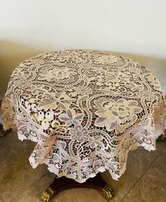 a round table with a white doily on it