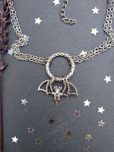 PLEASE read my shop announcement before placing an order so you know what to expect right now. Plus, when ordering from outside Europe, don't forget to provide a phone number for the courier to ensure the fastest and smoothest delivery. Witchy bat choker O ring necklace. Perfect for Samhain / Halloween, or your witchy everyday Short necklace, total length is 13 inches, about 43 cm. It fastens with a strong lobster clasp, and has a 2 inches, 5cm., extension chain. I can make this in your desired Silver Choker For Halloween Gift, Silver Fantasy Jewelry For Halloween, Handmade Silver Choker For Halloween, Witchy Metal Jewelry For Halloween, Adjustable Silver Choker For Halloween, Silver Vampire Style Choker As Gift, Silver Metal Choker For Halloween, Handmade Vampire Jewelry For Halloween, Halloween Metal Jewelry With Adjustable Chain