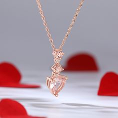 Wear this enchanting necklace as a reminder of the beauty and power of love. Let the gentle pink hues of the morganite stones evoke feelings of warmth and affection, while the heart-shaped design serves as a constant reminder of the love that resides within your heart. Crafted with precision, this exquisite piece features a heart-shaped morganite gemstone as its centerpiece, radiating a captivating pink hue that symbolizes love and tenderness. Above the main stone, two delicate morganite gems an Rose Quartz Gemstone Necklaces For Weddings, Morganite Rose Gold Jewelry Gift, Pink Morganite Jewelry Gift, Elegant Crystal Necklace With Heart Charm, Rose Gold Heart Cut Birthstone Necklace, Pink Morganite Jewelry As A Gift, Rose Gold Heart Cut Birthstone Necklaces, Pink Morganite Jewelry For Gift, Formal Pink Heart Cut Necklace