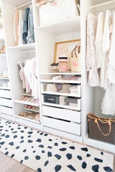 an organized closet with clothes and handbags