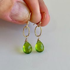 Lime Green Earrings For Gift, Green Peridot Teardrop Earrings, Green Faceted Teardrop Earrings, Peridot Dangle Earrings With Ear Wire, Green Briolette Earrings For Pierced Ears, May Birthstone Drop Earrings, Peridot Teardrop Earrings For May Birthstone, Teardrop Peridot Earrings For May Birthstone, Peridot Properties