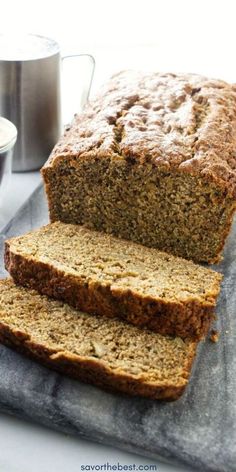 two slices of banana bread sitting on top of a cutting board