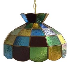 a multicolored stained glass chandelier hanging from a chain