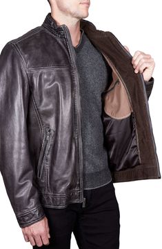 An antiqued finish adds a richly aged patina for a fitted leather jacket crowned with a snap-tab band collar and equipped with a trio of zip pockets. Corduroy lines the collar, cuffs and placket for a soft-touch finish. Fit: True to size.Considered a Regular fit; cut with a little extra room through the chest and body for comfort. 26" length (size M) Professional leather cleaner 100% Lamb leather Band collar with snap-tab closure Long sleeves with adjustable snap cuffs Chest zip-welt pocket Fron Fitted Distressed Brown Leather Jacket Classic Style, Fitted Classic Leather Jacket In Distressed Brown, Distressed Brown Fitted Leather Jacket Classic Style, Classic Fitted Distressed Brown Leather Jacket, Classic Distressed Brown Leather Jacket For Winter, Classic Winter Leather Jacket In Distressed Brown, Leather Racing Jacket, Fitted Leather Jacket, Formal Accessories