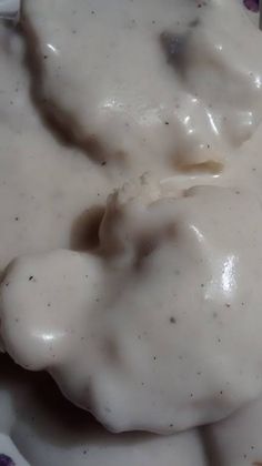 a close up of a plate of food with gravy