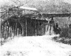 an old black and white photo of people walking down a dirt road